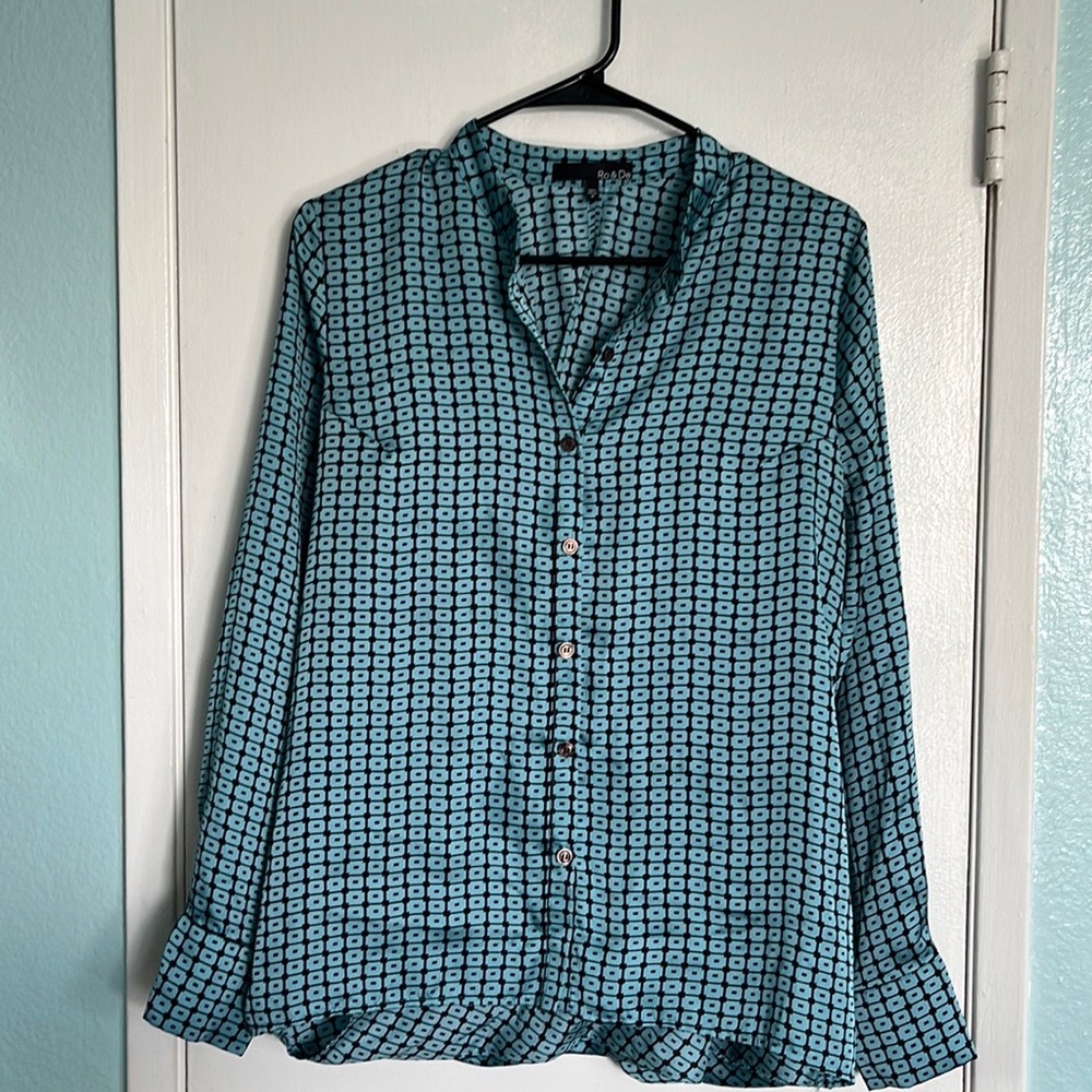 Cute print with stylish “split” seam in back. Poly, lightweight, wash, hang dry.